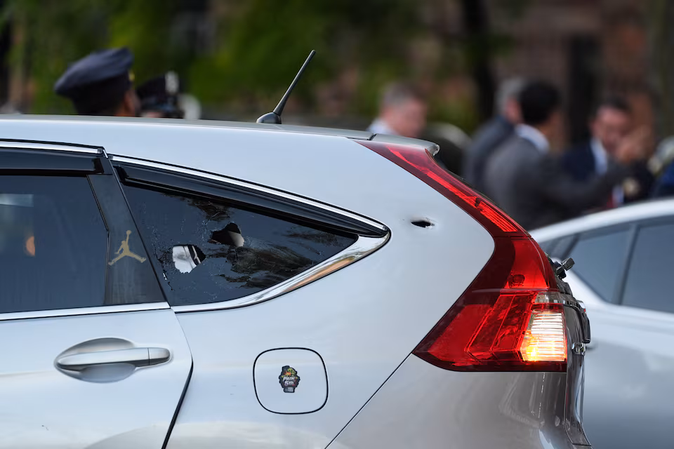 A vehicle bearing a bullet hole at the scene of a shooting involving US Immigration and Customs Enforcement (ICE) officers in the Bronx, New York City, on October 8, 2026